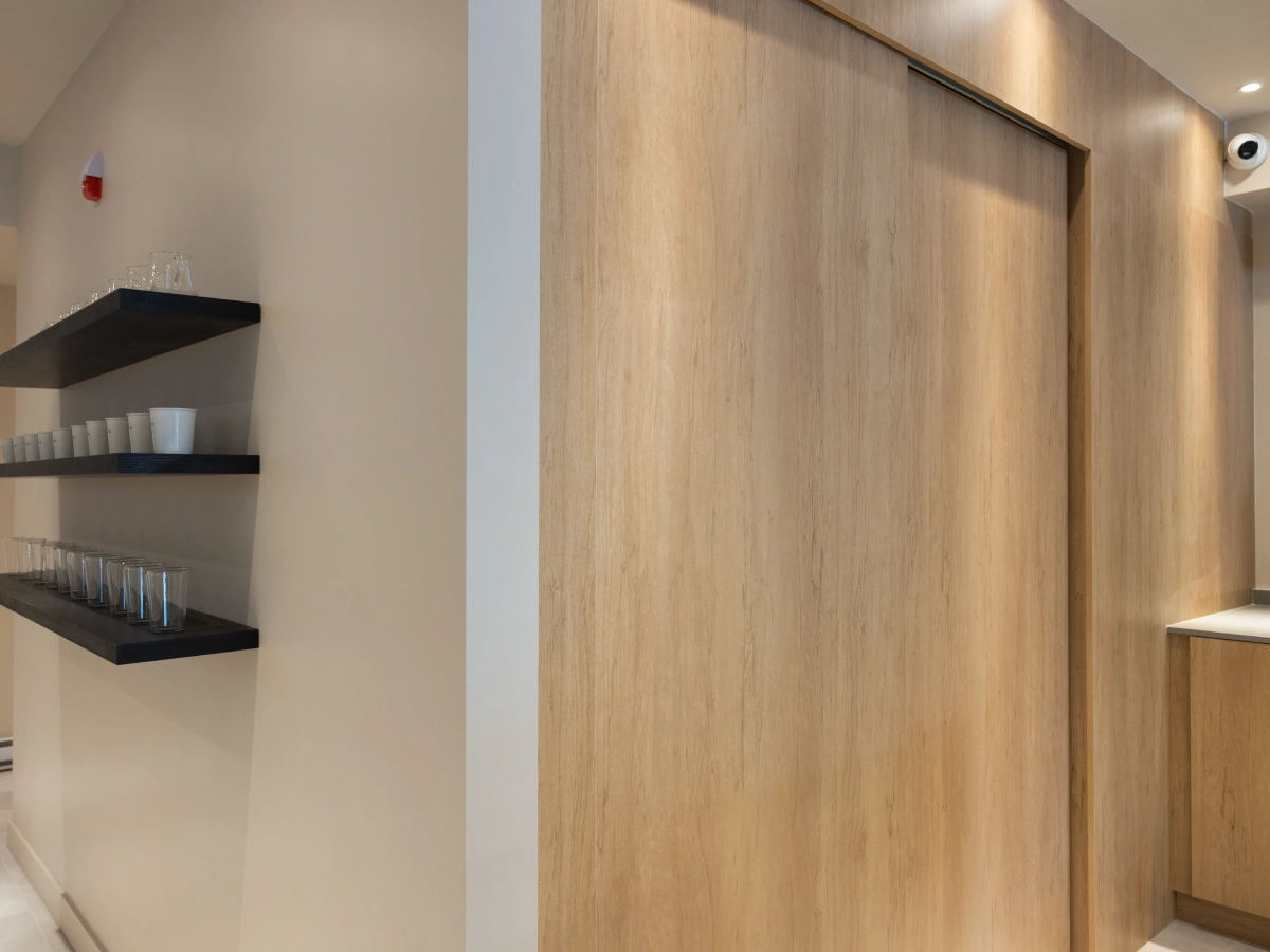 three dots coffee shop millwork concealed door wall